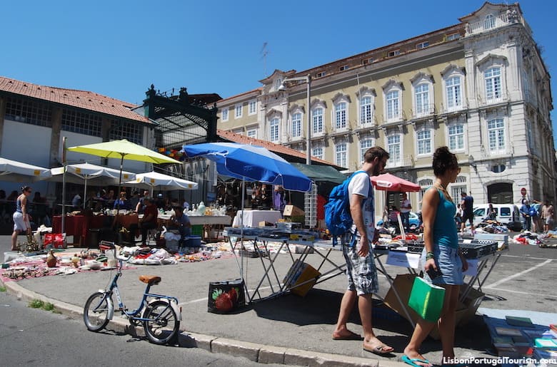 Browsing the Feira da Ladra flea market in Alfama, Lisbon